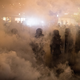 Riot police shrouded in gas on the streets of Hong Kong on July 21, 2019.